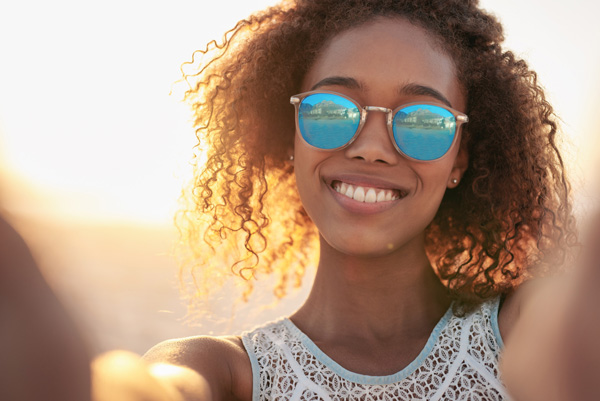 Woman wearing sunglasses from Midwest Vision Centers
