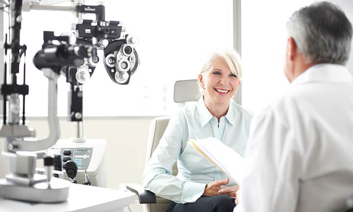 Woman receiving eye exam at Midwest Vision Centers